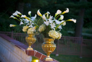 flowers in large golden vases